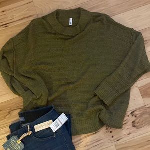 Sweater olive green in color